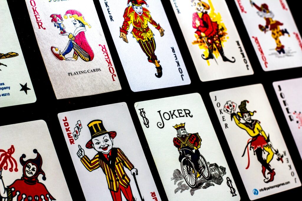 a group of playing cards with clowns on them