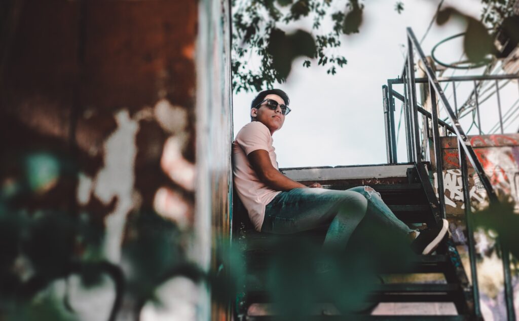 man sitting on stair steps