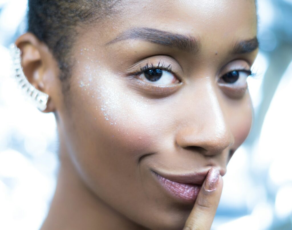 a close up of a person with a ring on her finger